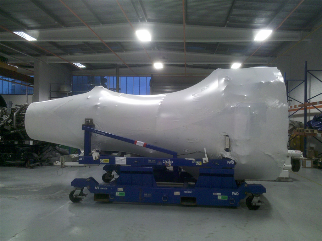 Jet engine wrapped for storage and transport. Gallery Image