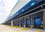 A row of loading dock bays, with dock leveller, dock door, wheel guides and dock shelter Gallery Thumbnail