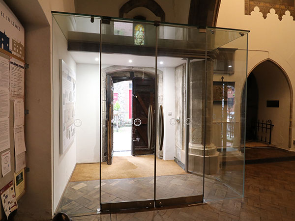 Glass porch to Church with secure doors featuring custom manifestations  Gallery Image