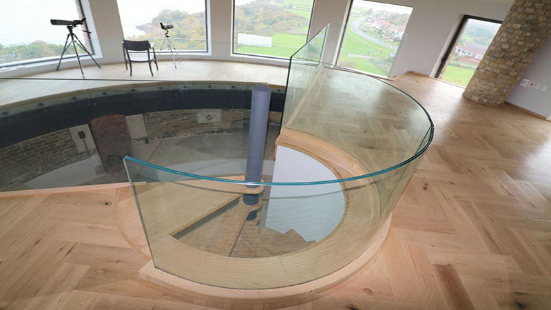 Frameless curved glass balustrade to spiral staircase  Gallery Image
