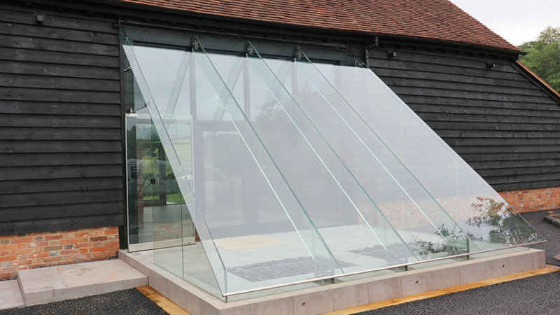 Frameless glass porch with secure glass doors  Gallery Image