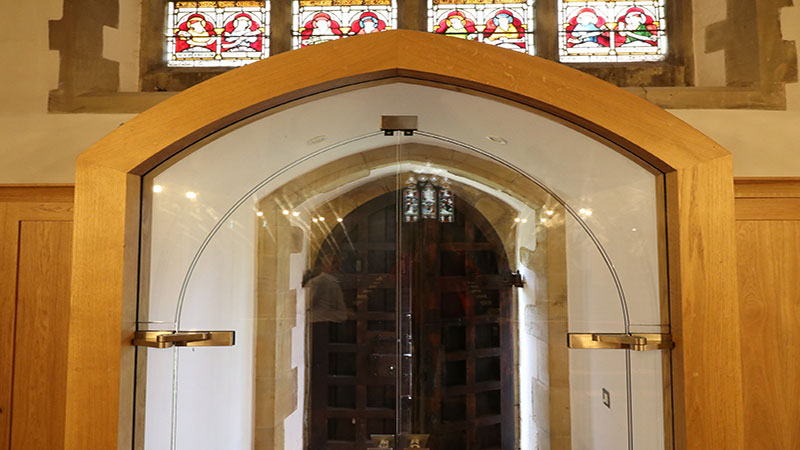 Custom arced glass doors and screen in church entrance  Gallery Image