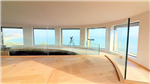 Frameless channel set glass balustrade protecting floor edge in Martello Tower Gallery Thumbnail