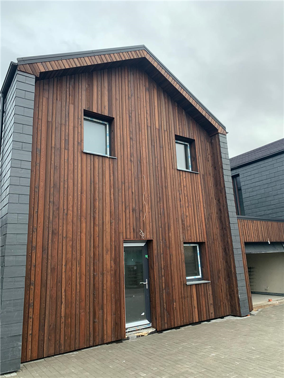Red amber larch charred timber cladding Gallery Image