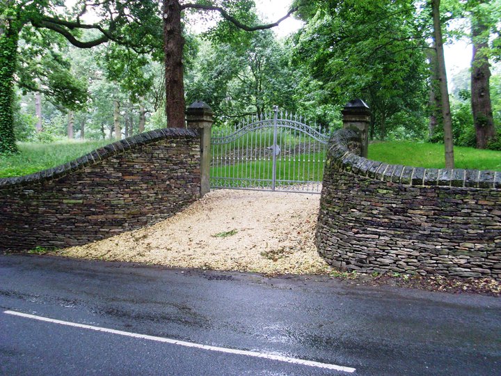 Curving dry stone walls and gates designed and built by www.richardclegg.co.uk Gallery Image