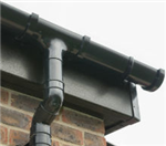 Black Ash woodgrain fascia with black Freeflow half-round gutters Gallery Thumbnail