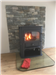 Clearview Solution 500 Stove with stone backdrop Gallery Thumbnail