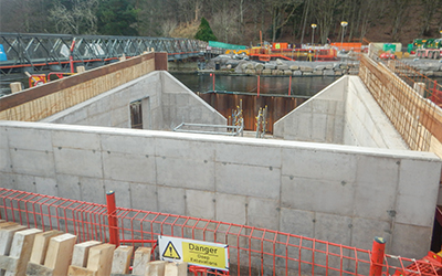 Pooley Bridge, England. 
Betts Construction formed the abutments within the cofferdams using the EFCO HAND-E-FORM system. These all-steel face sheets leave a single line. Gallery Image