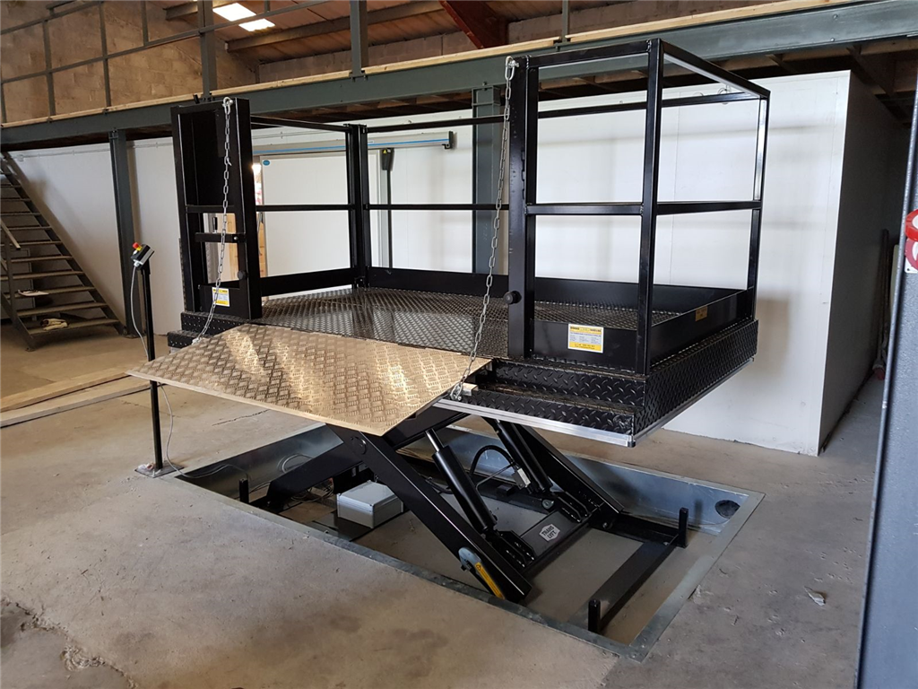 Here we designed & Installed a goods lift to allow our client to load & unload pallets from a truck safely, this particular Scissor Table/ Goods Lift also allows a person to to travel on the lift. Gallery Image